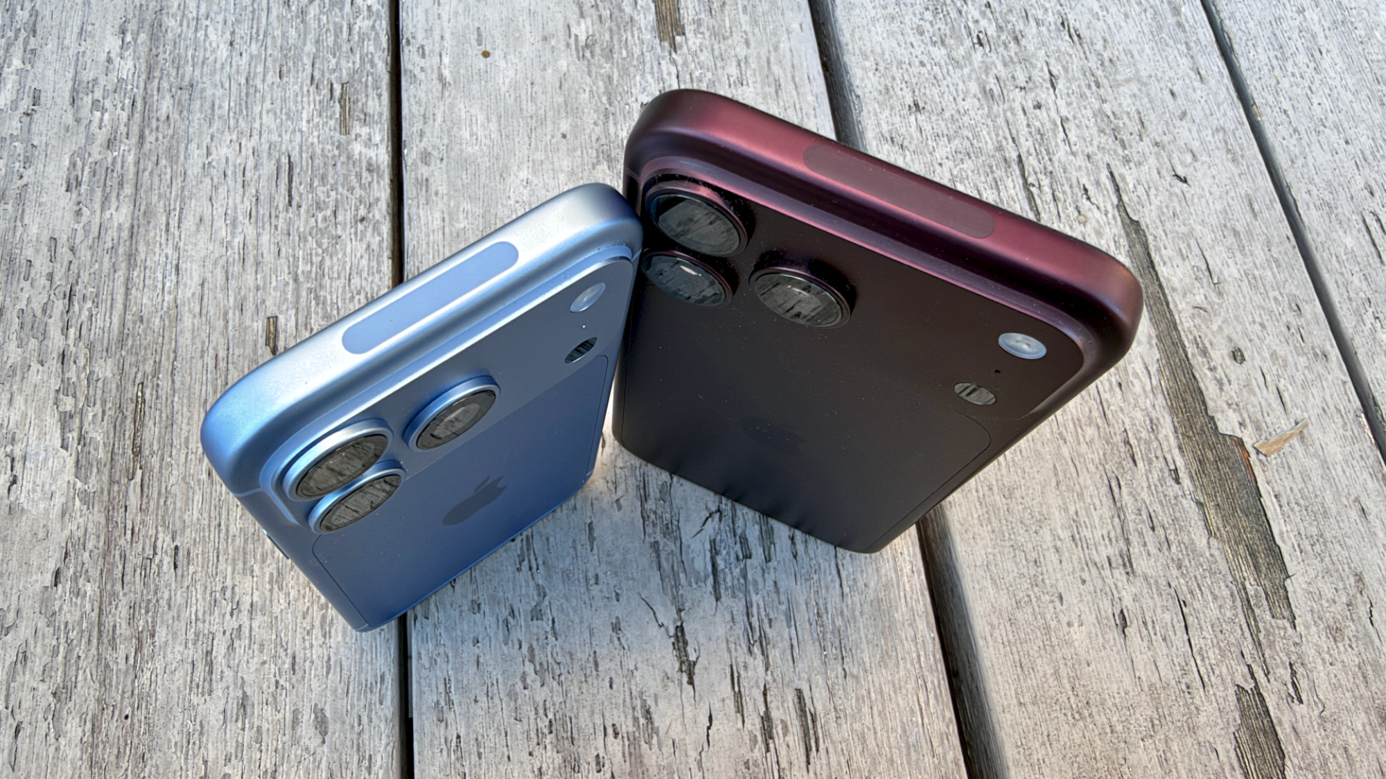 the iphone 18 pro in glacier and iphone 18 pro max in burgundy standing up
