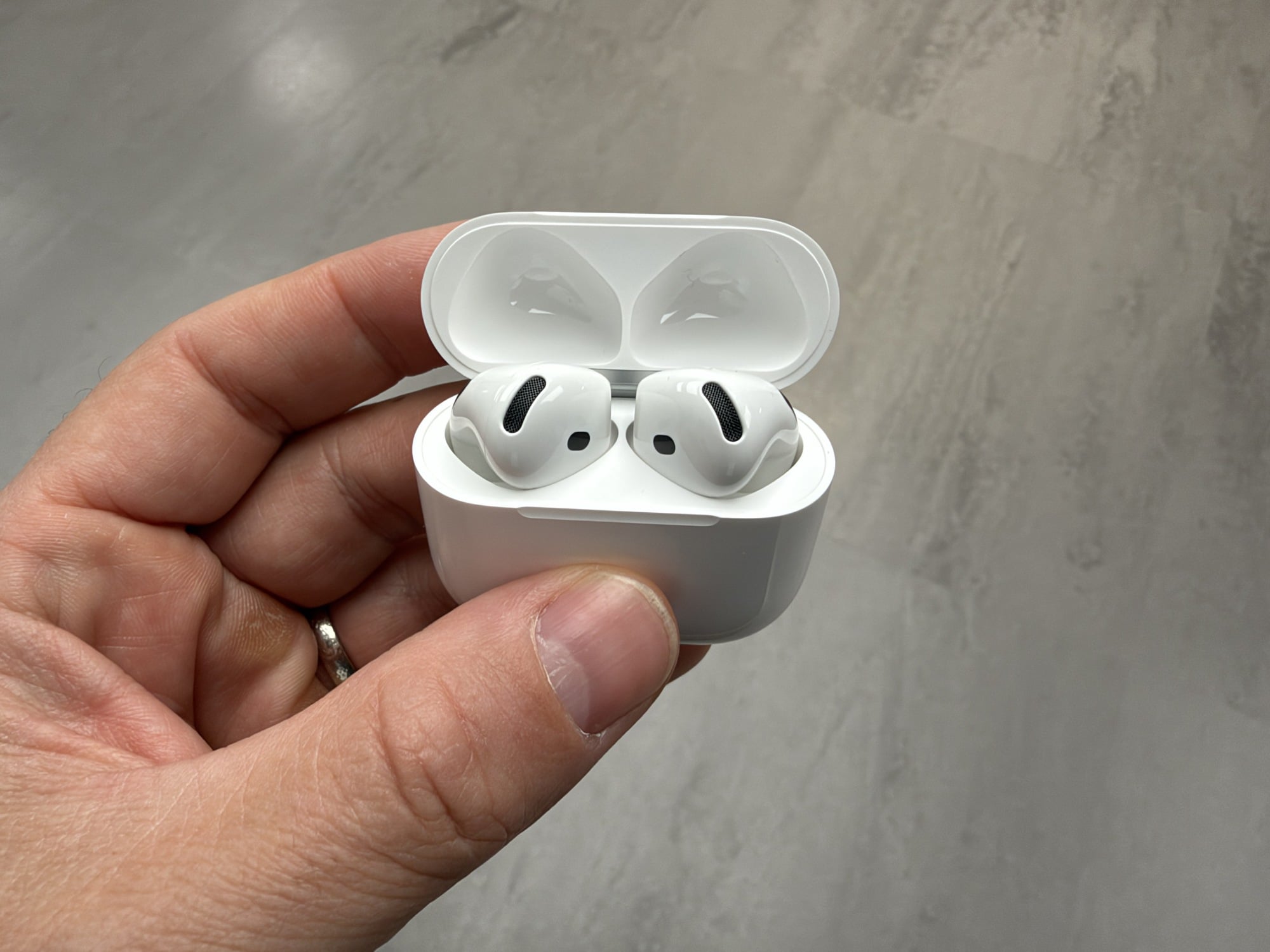top down view of airpods 5 earbuds in open case