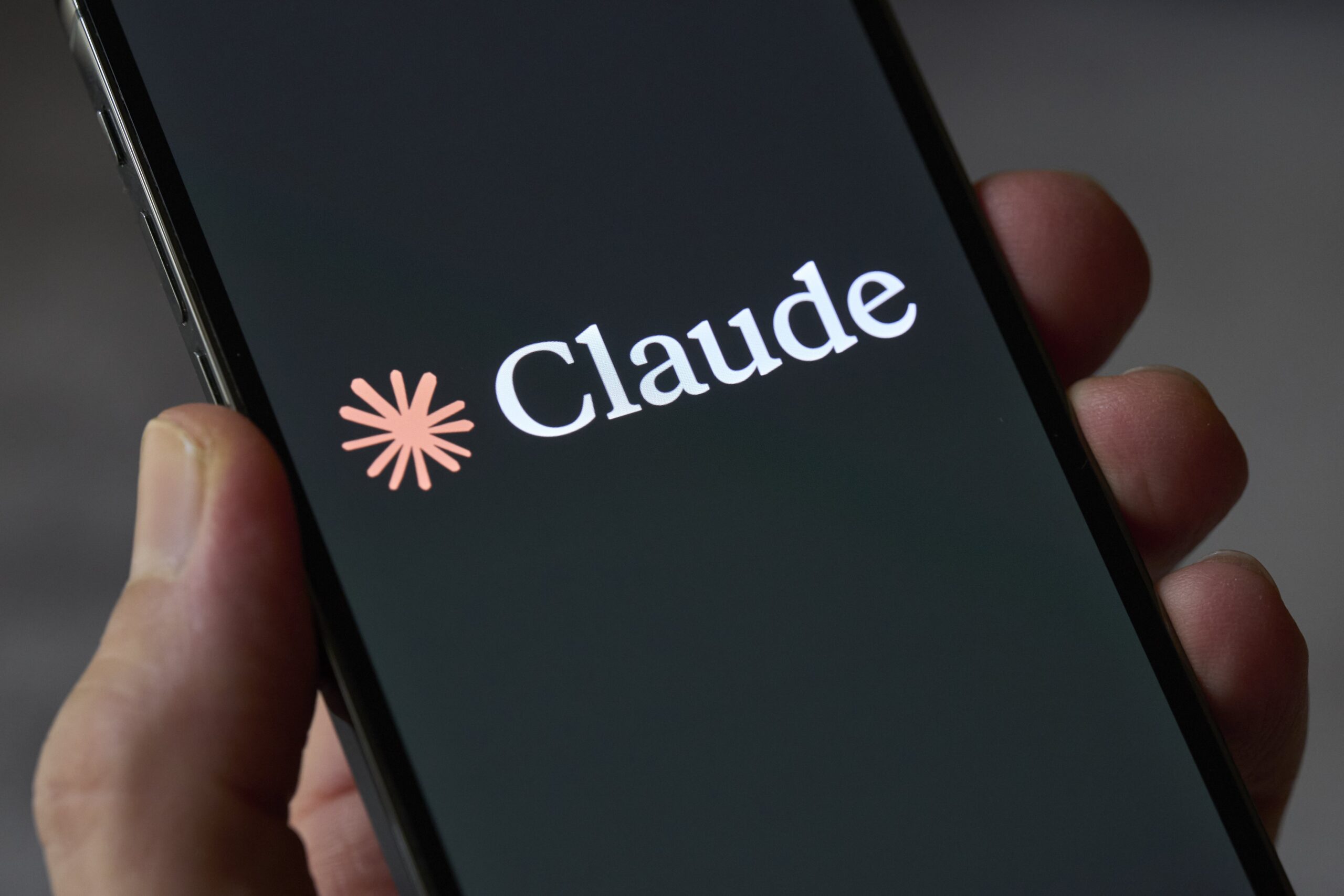 claude logo on smartphone