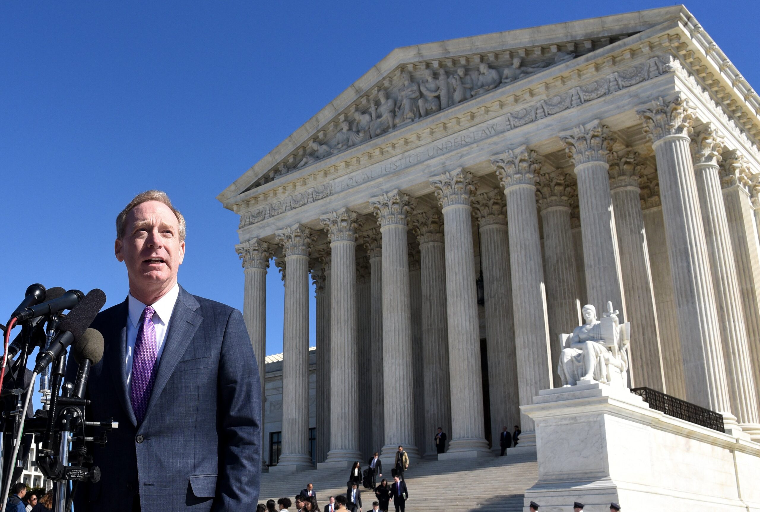 Brad Smith, President and Chief Legal Officer of Microsoft speaks during a press conference following oral arguments at the Supreme Court on US vs. Microsoft in front of the Supreme Court in Washington, DC, on February 27, 2018. Microsoft is facing off with the US government before the Supreme Court over a warrant for data stored abroad that has important ramifications for law enforcement in the age of global computing