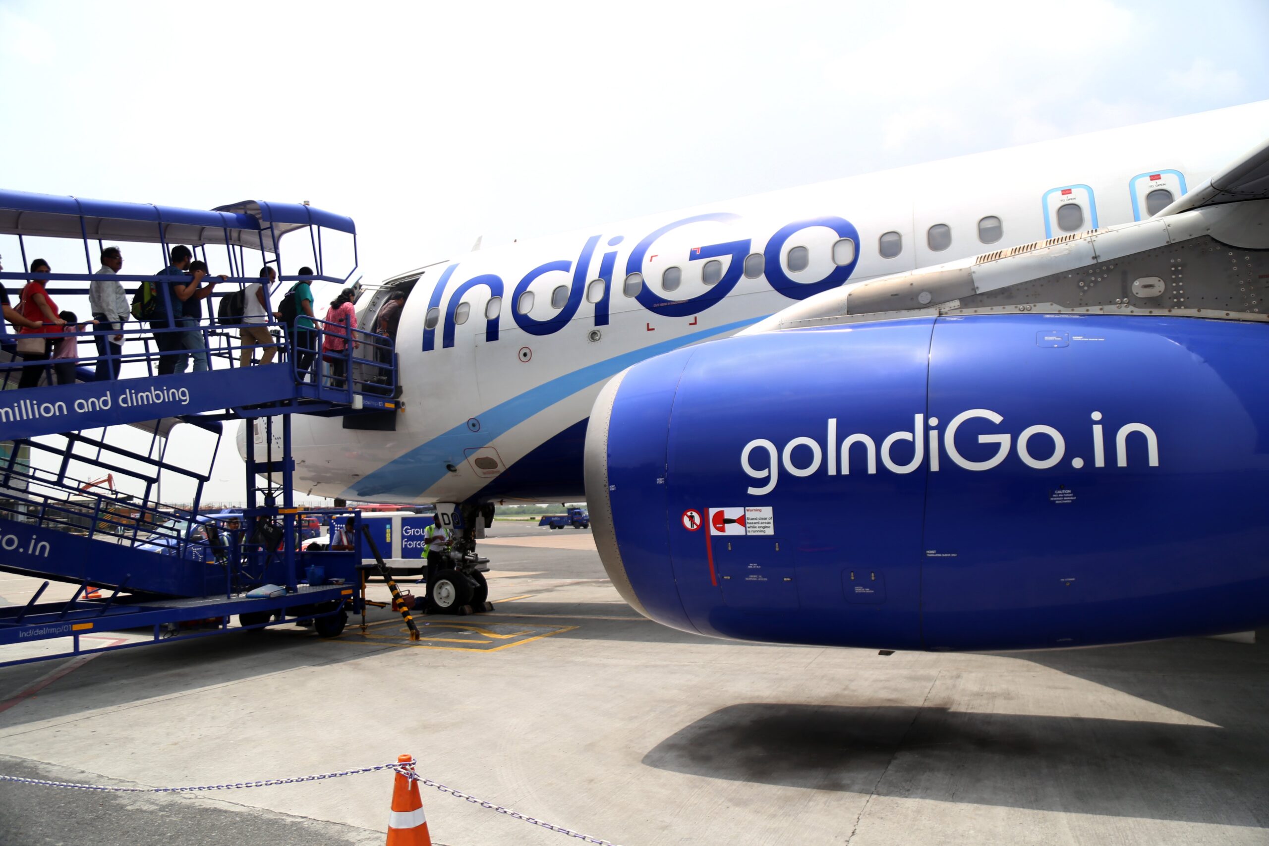 New Delhi, India, July 29, 2018 : Travelers entering an airplane ready for departure at Indira Gandhi International Airport. Indira Gandhi International Airport serves as the major international aviation hub of the Indian capital city of New Delhi as well as India.