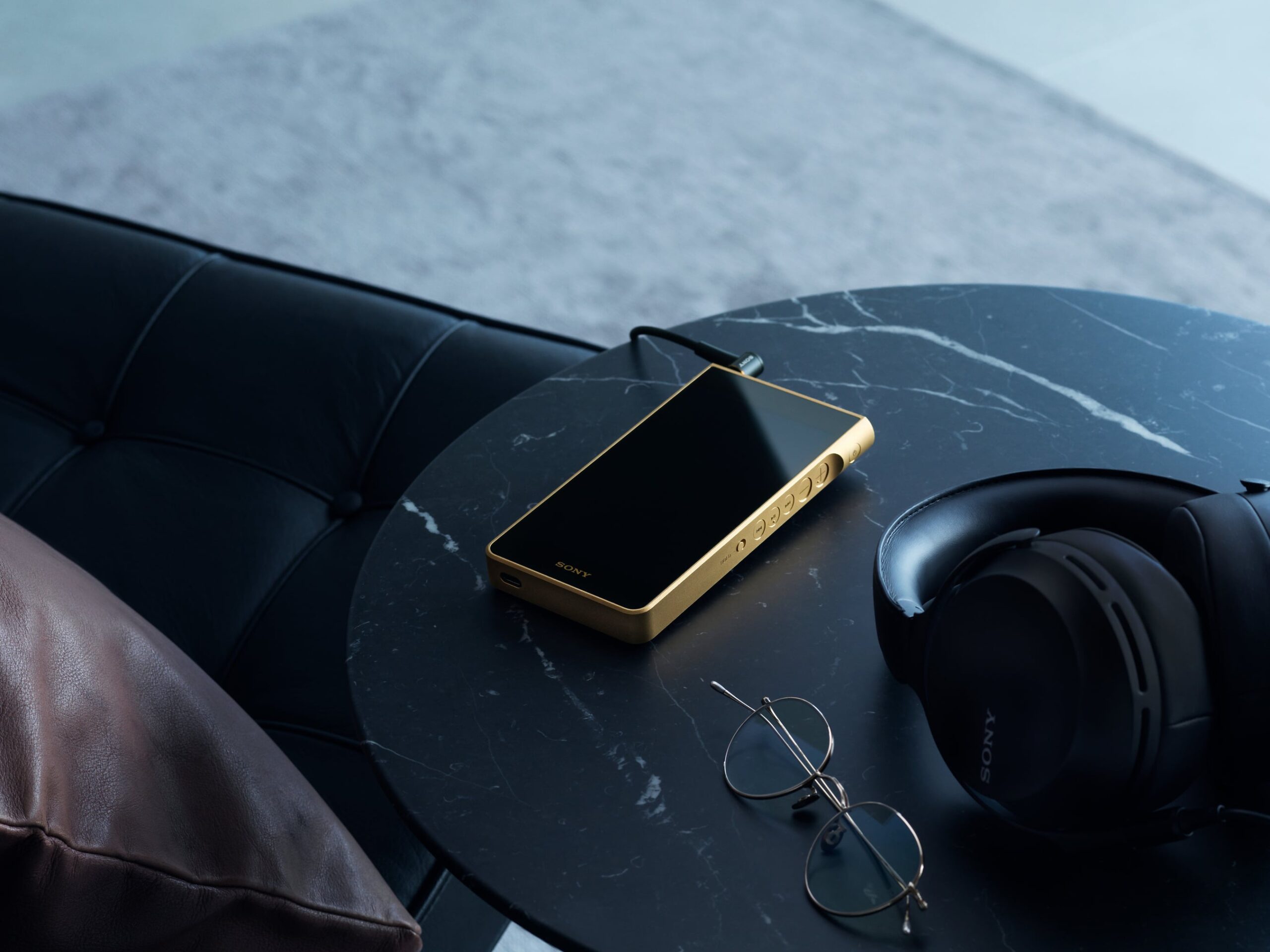 Sony gold-played walkman on table