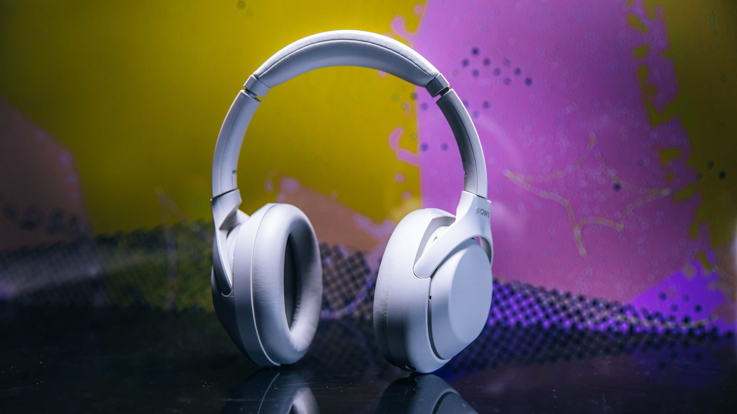 pair of sony 1000xm4c headphones with dramatic lighting