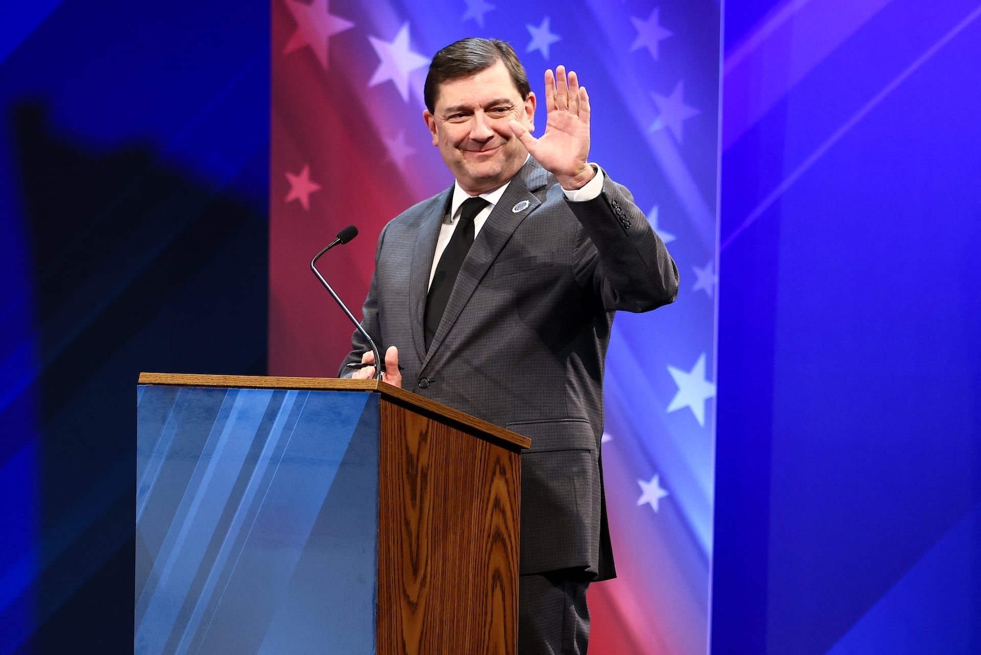 Democratic Senate candidate Troy Jackson appears at a debate lectern. 