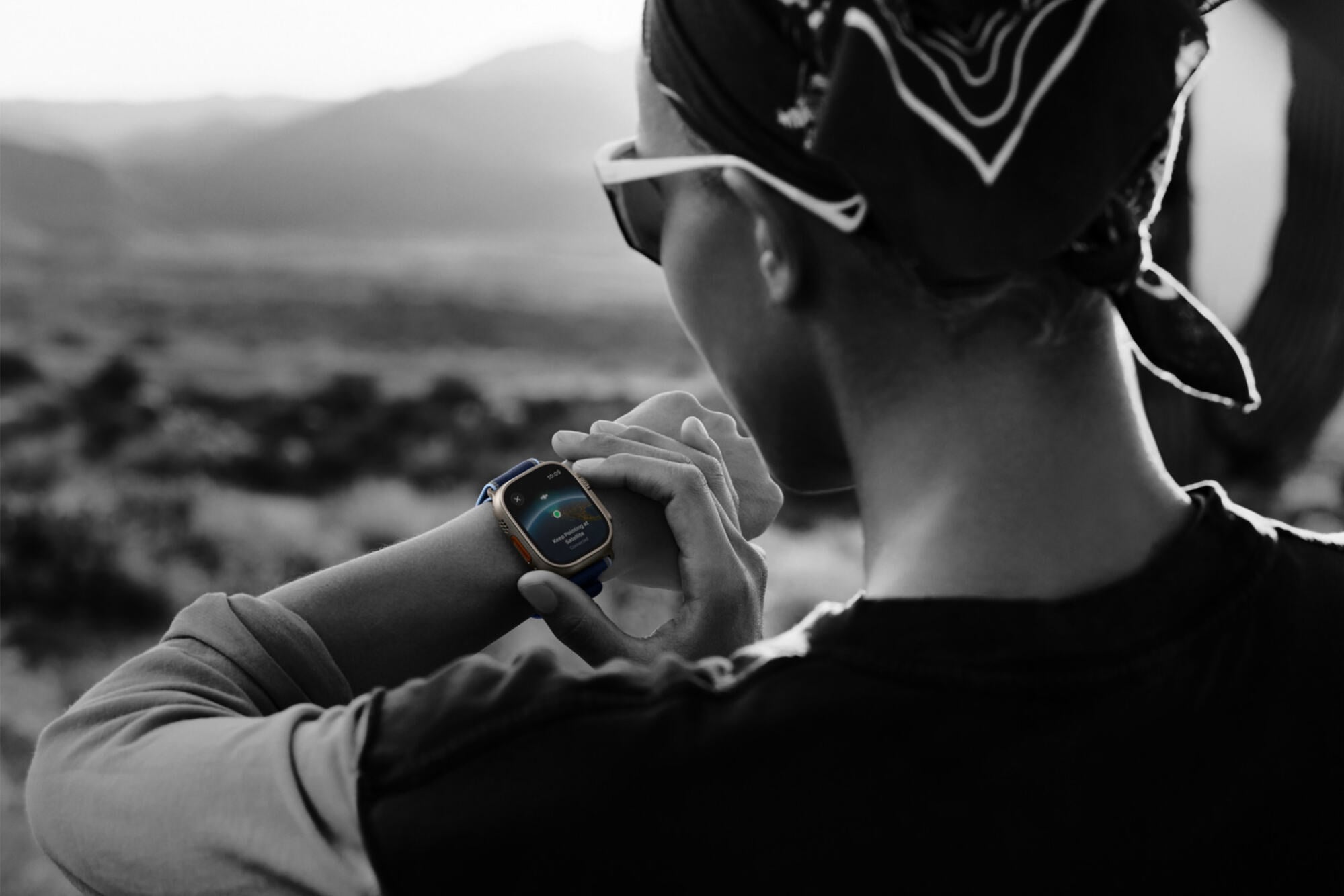 a person adjusting their apple watch ultra 3