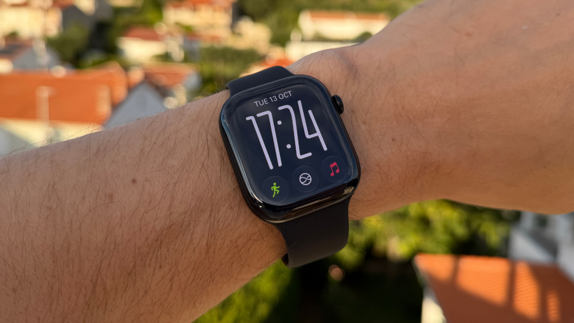 the apple watch series 12 on a man's wrist