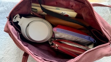 folded sony headphones in bag