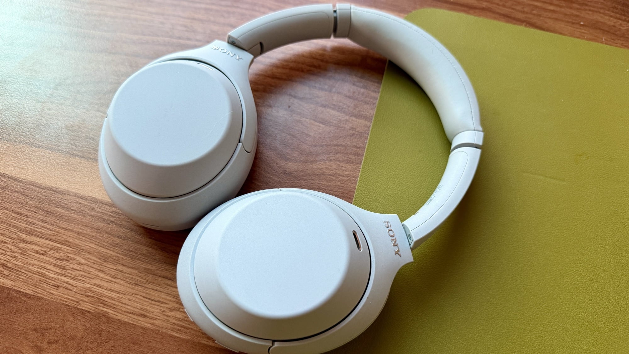 pair of sony xm4c headphones on a desktop